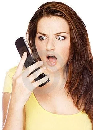 woman-looking-shocked-at-her-phone-thumb11063485