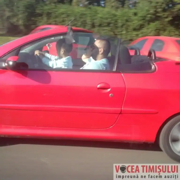 șofer cu copilul în brațe la volan6 jpg